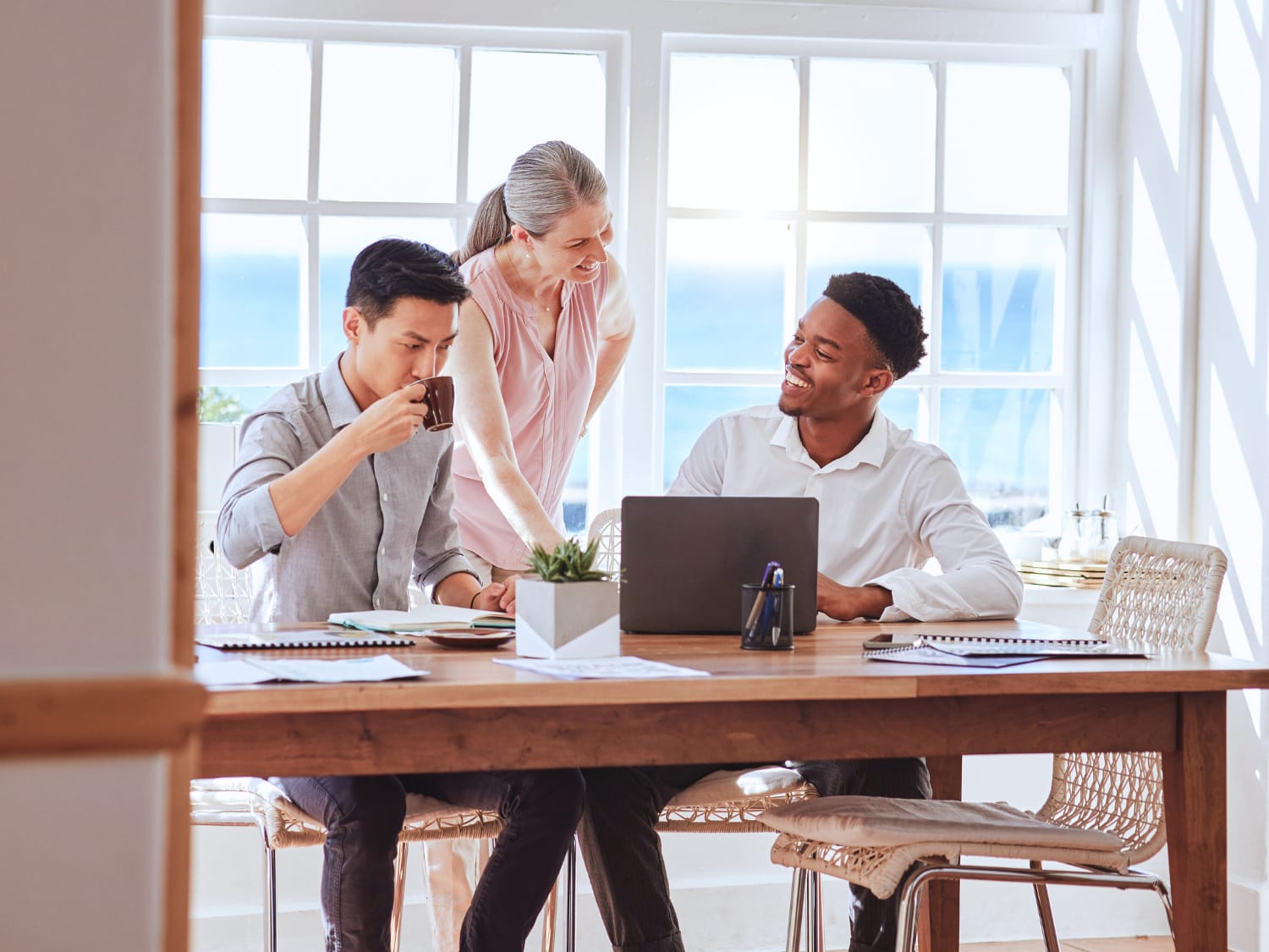 Leaders collaborating around a shared canvas