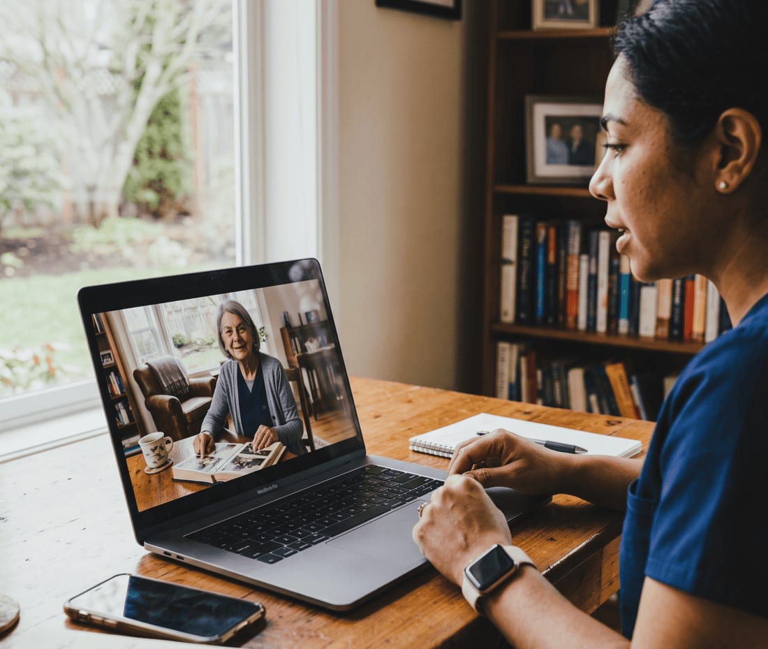 BloomCare RN conducting a virtual care visit with an older adult patient at home.