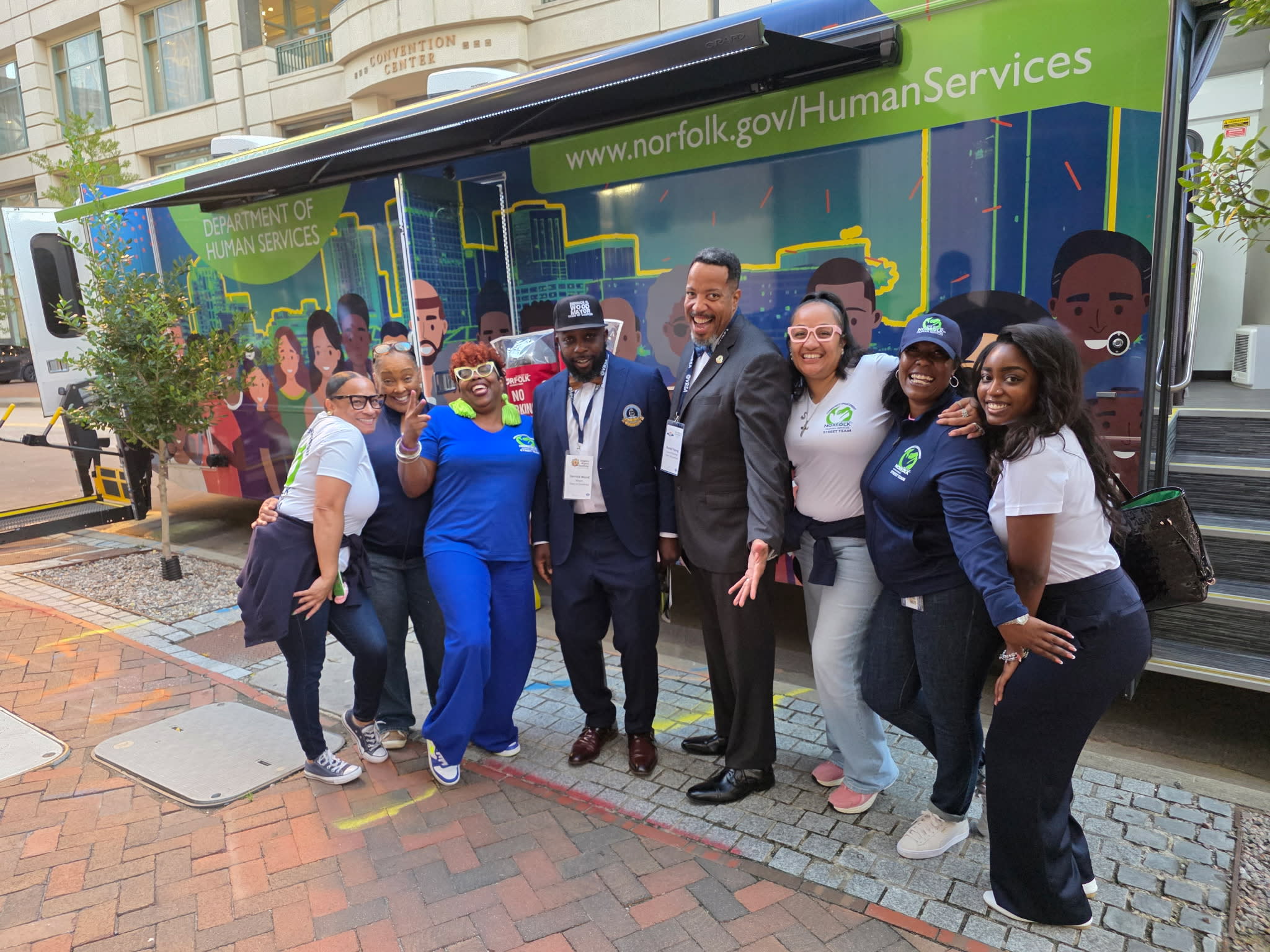Local government leaders visit a Norfolk community outreach initiative.